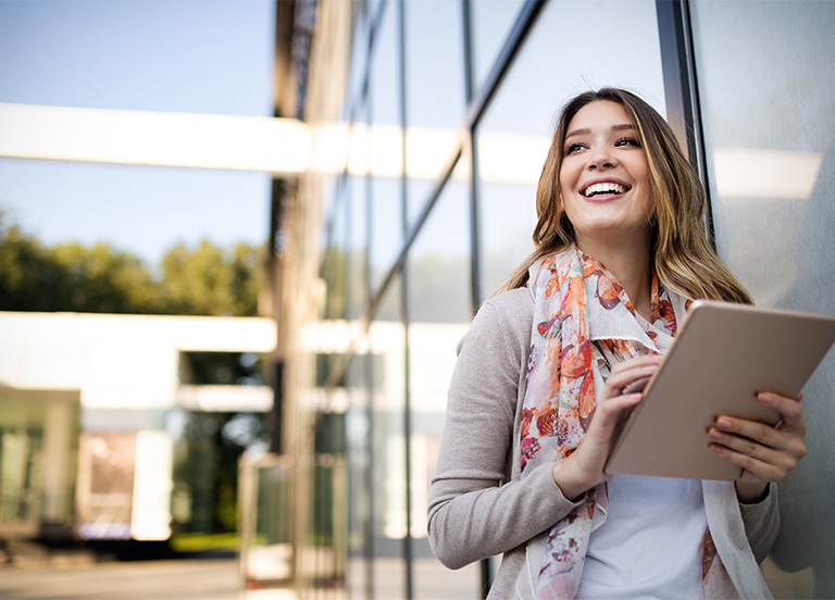 woman standing in front of office building