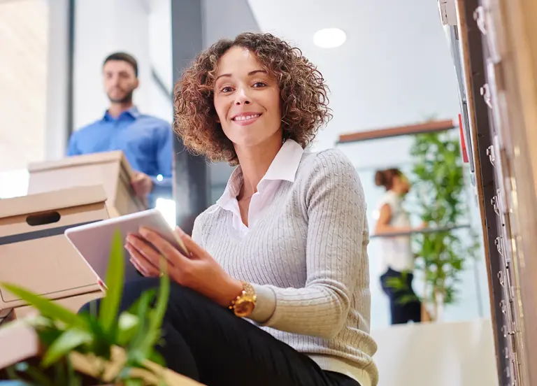 Employee managing relocation details during a corporate group move