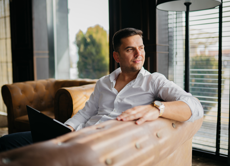 Young businessman working on a sofa