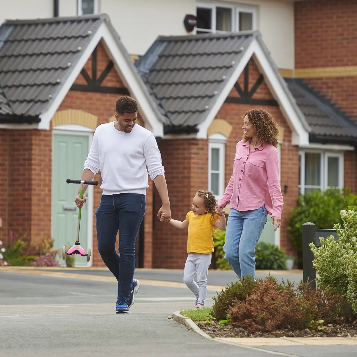 Family walking through a housing development