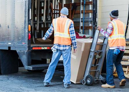 men-loading-appliance-into-truck