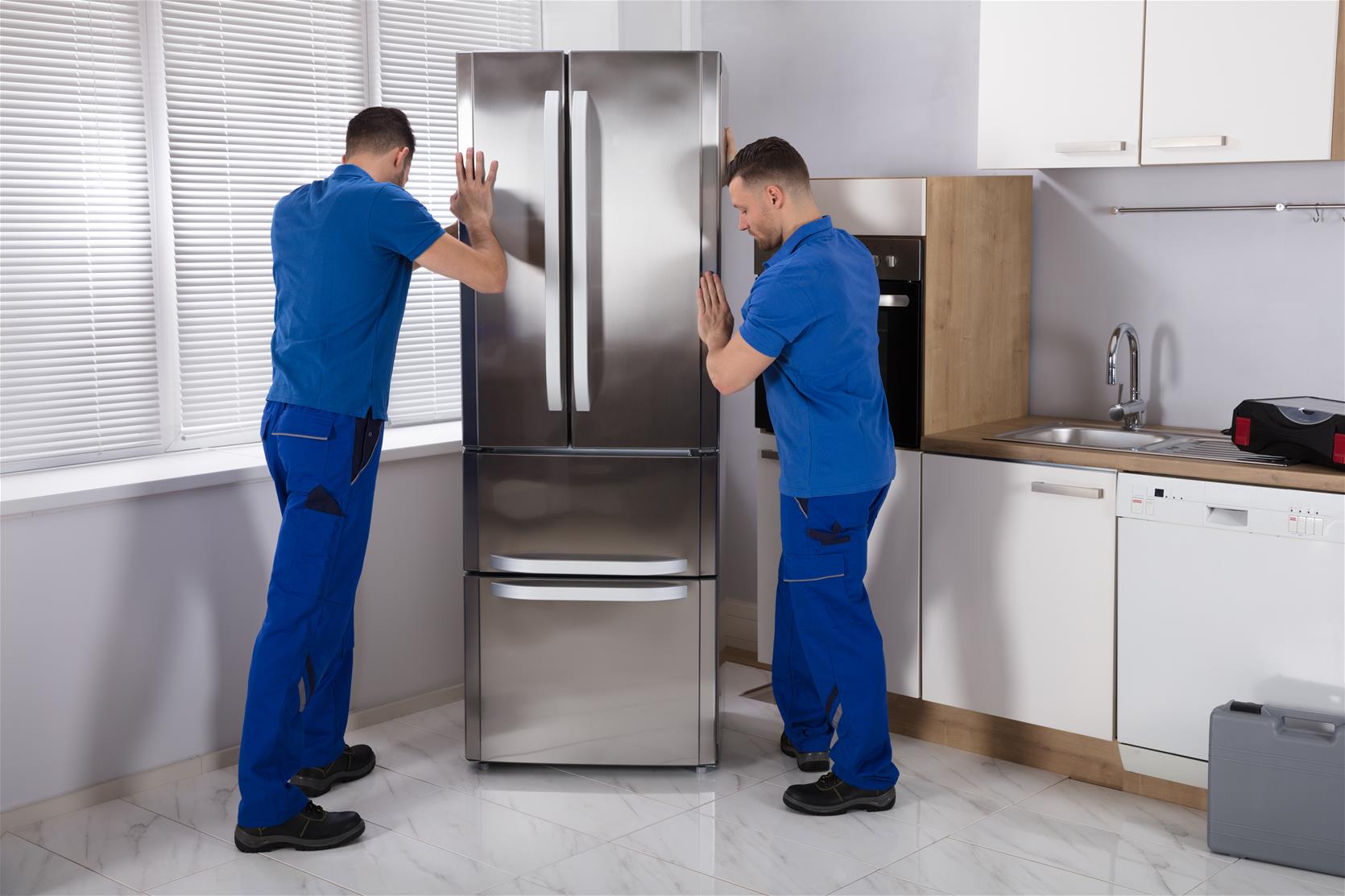Men moving Refrigerator